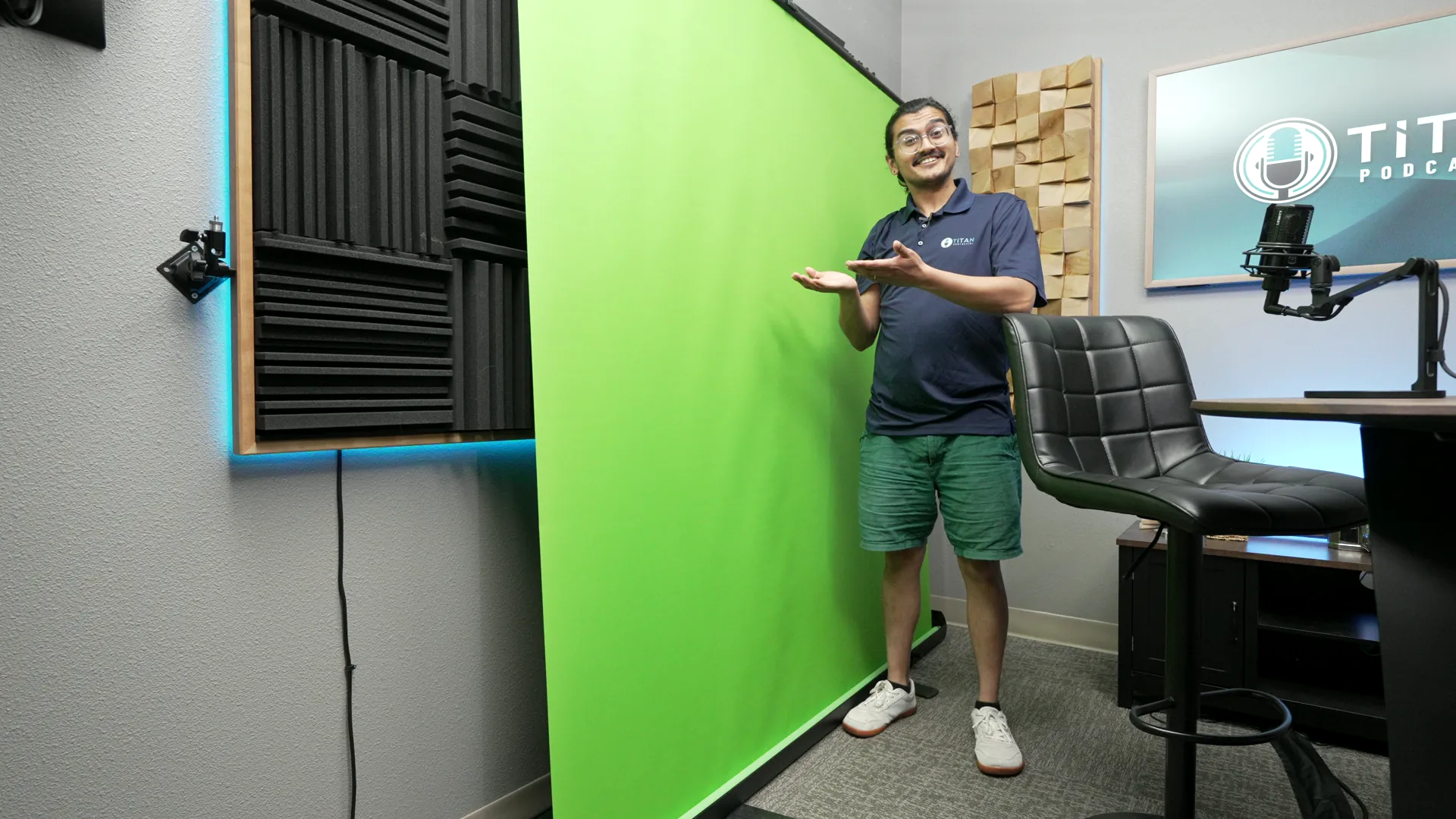 Raul Patel demonstrating the Titan Podcasting green-screen setup